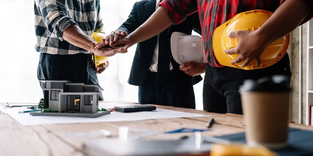 general contractor reviewing project documents and schedule